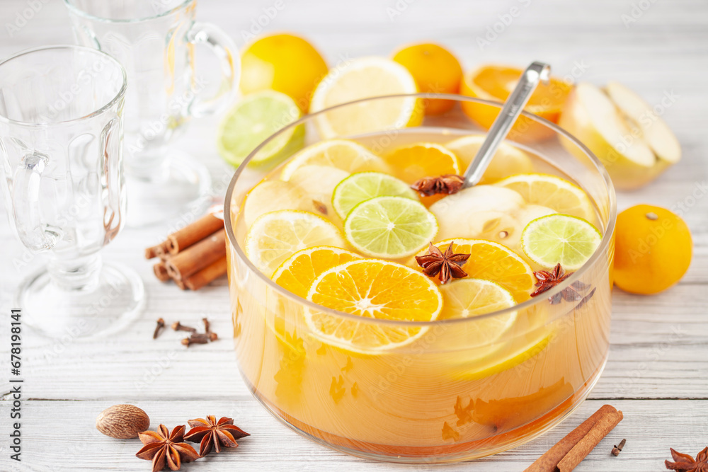 Homemade hot alcohol apple cider punch with cinnamon sticks, anise star and spices Homemade hot alcohol apple cider punch with cinnamon sticks, anise star and spices
