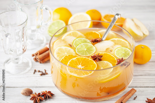 Homemade hot alcohol apple cider punch with cinnamon sticks, anise star and spices
