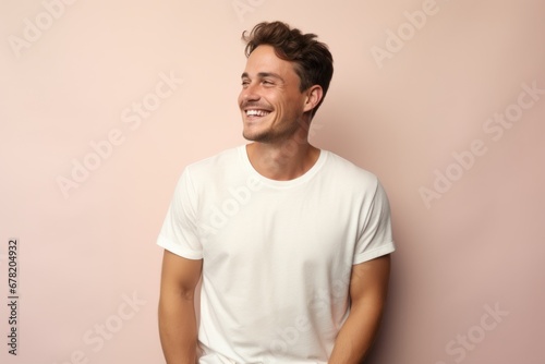 Portrait of a smiling man in his 30s donning a trendy cropped top against a pastel or soft colors background. AI Generation