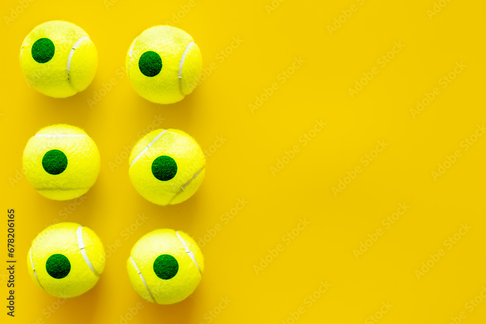 Fototapeta premium Set of green tennis balls, top view. Sport games background