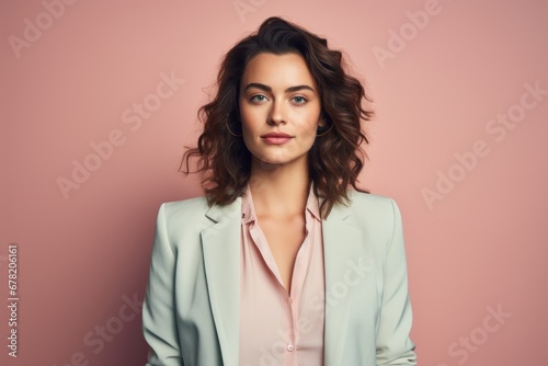 Portrait of a glad woman in her 20s dressed in a stylish blazer against a pastel or soft colors background. AI Generation © CogniLens