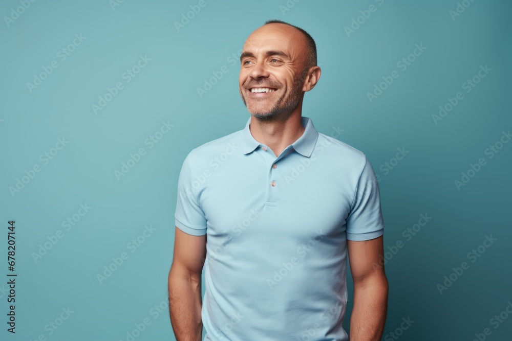 Portrait of a happy man in his 30s donning a classy polo shirt against a solid color backdrop. AI Generation Portrait of a happy man in his 30s donning a classy polo shirt against a solid color backdrop. AI Generation