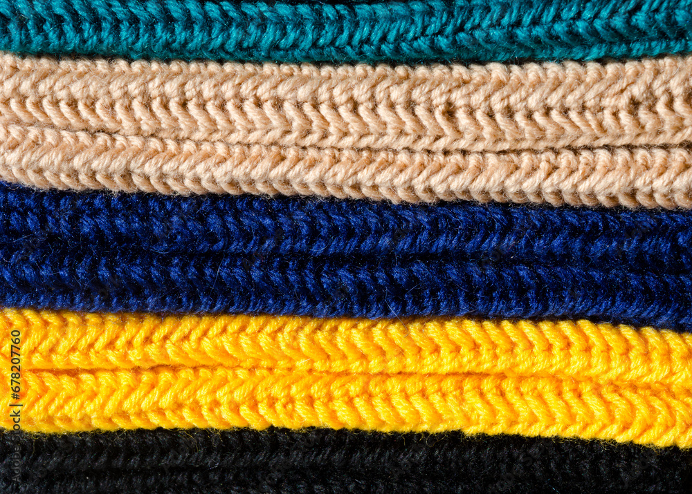 Mittens made of wool yarn close-up. Mittens made of wool yarn close-up.