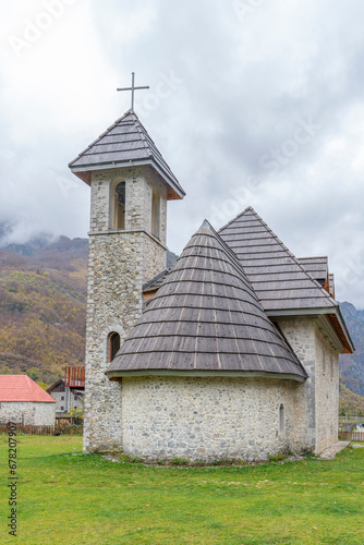 albania theth national park and stone church among mountains blue sky over valley