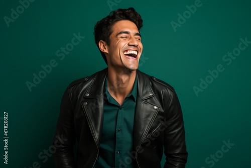 Portrait of a smiling man in his 20s sporting a stylish leather blazer against a solid color backdrop. AI Generation