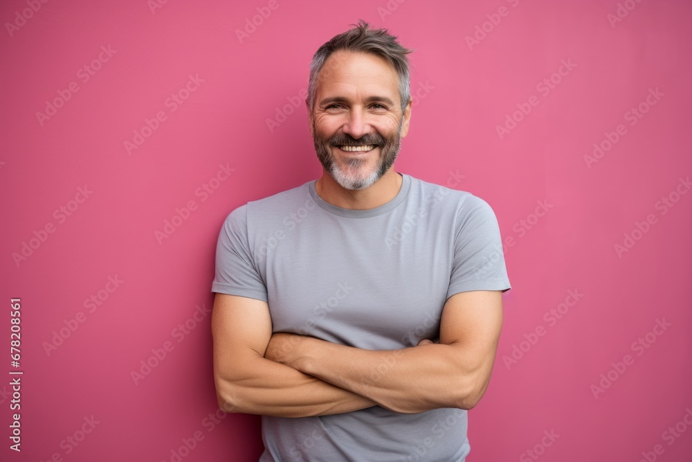 Portrait of a happy man in his 40s sporting a vintage band t-shirt against a solid pastel color wall. AI Generation Portrait of a happy man in his 40s sporting a vintage band t-shirt against a solid pastel color wall. AI Generation