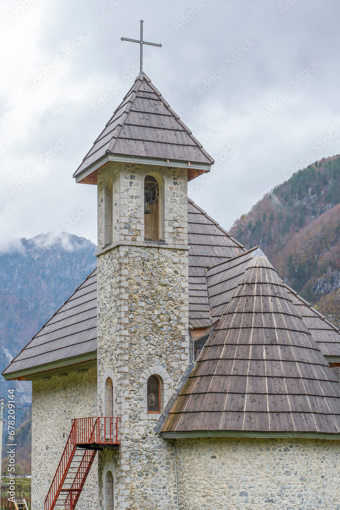 albania theth national park and stone church among mountains blue sky over valley