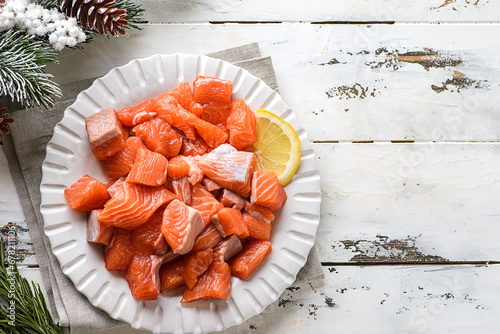 pieces of raw salmon in winter composition