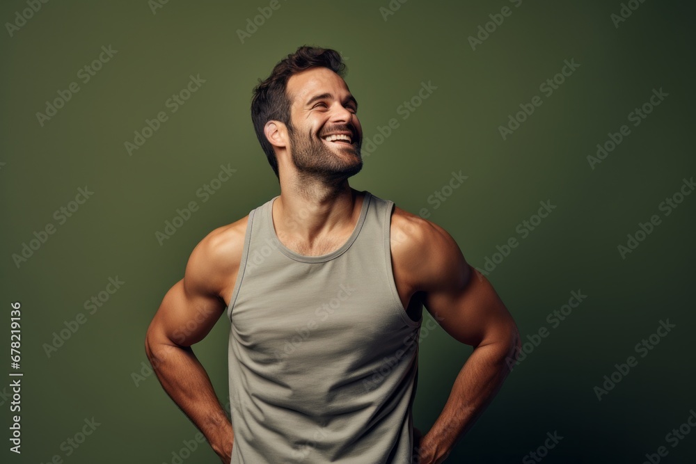 Fototapeta premium Portrait of a blissful man in his 30s wearing a lightweight running vest against a plain cyclorama studio wall. AI Generation