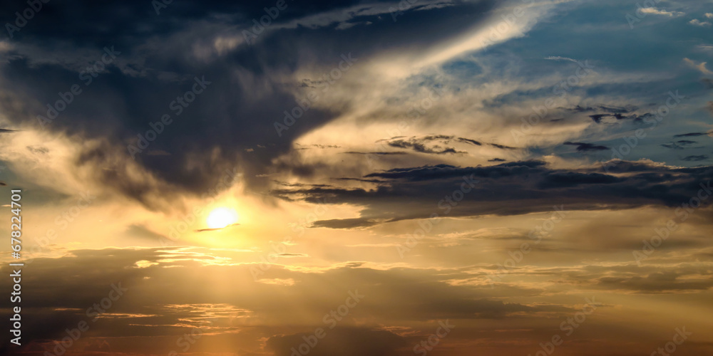 a sunset with dramatic clouds and rays of sunlight.