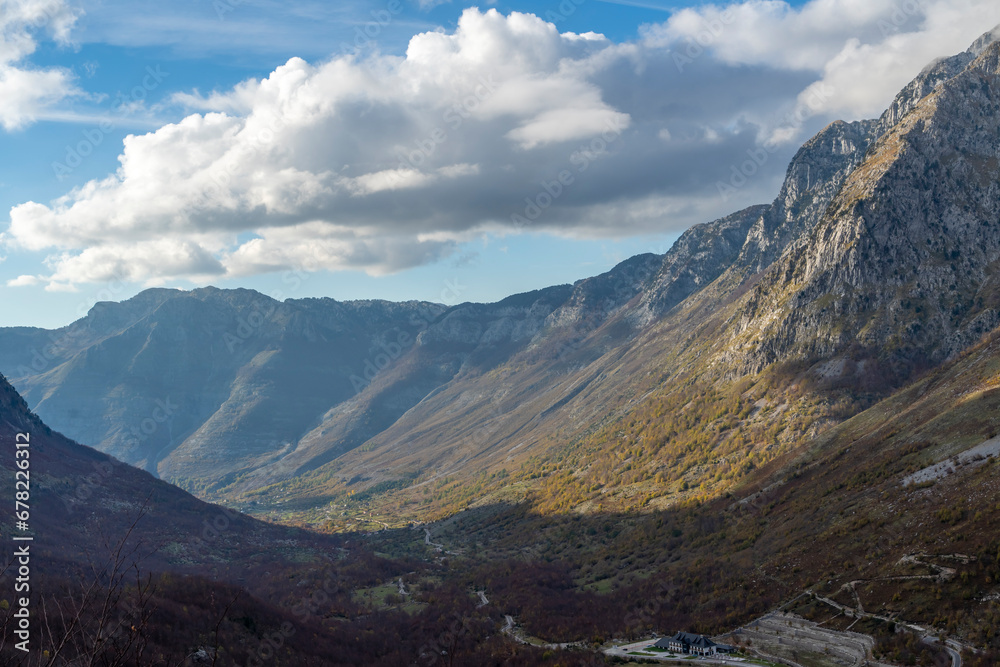 blue sky over valley among albania theth national park and mountains