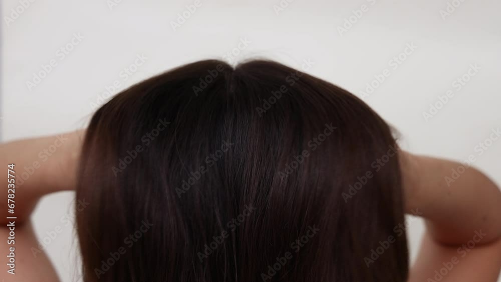 millennial woman brushing hair with eco wooden comb,smiling girl happy to have healthy hair.hand in surgical glove analyzing scalp without dandruff.female looking in double side mirror,holding elastic millennial woman brushing hair with eco wooden comb,smiling girl happy to have healthy hair.hand in surgical glove analyzing scalp without dandruff.female looking in double side mirror,holding elastic