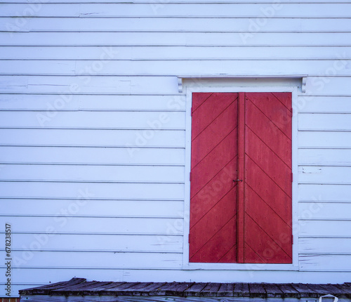 Colorful red door on Archer House in Yorktown, Virginia