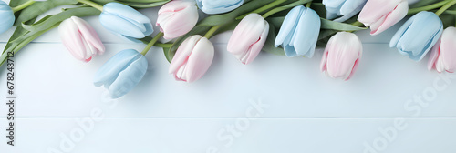 Long wide banner with tulips on a light stone background. Free copy space for text. Greetings card idea, invitation for wedding reception ora valentines mother's day. Generative AI. #678248712