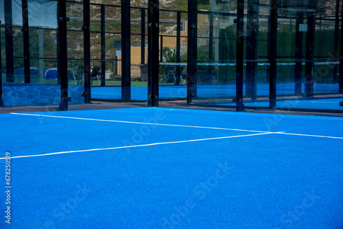 Net on a blue paddle tennis court photo