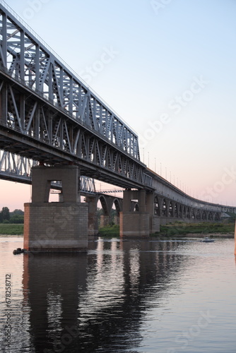 Bridge silhouette on background of sunset. Cityscape with sunset. © Bory_in_story