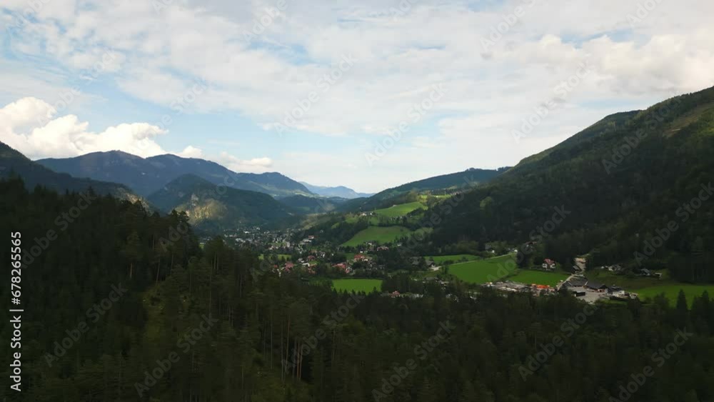 View of Austrian Alps landscape, mountain peak Sarstein in the morning mist and clouds. The meadow in foreground. View of Austrian Alps landscape, mountain peak Sarstein in the morning mist and clouds. The meadow in foreground.