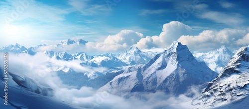 High mountain with white snow and blue sky landscape view © orendesain99