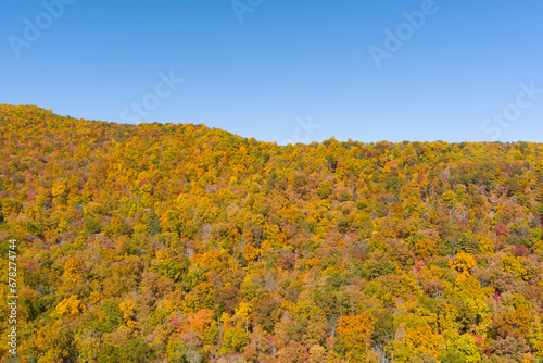 High angle view of vibrant autumn colors in the Blue Ridge Mountains of North Carolina, USA. © Wollwerth Imagery