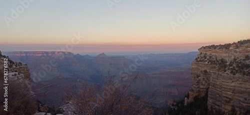 As the sun dips below the horizon, the Grand Canyon is enveloped in a captivating glow. This image, titled "Grand Canyon Glow: The Splendor of Twilight.