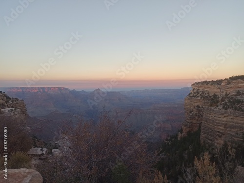As the sun dips below the horizon, the Grand Canyon is enveloped in a captivating glow. This image, titled "Grand Canyon Glow: The Splendor of Twilight. © caio