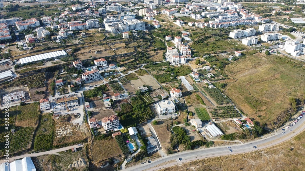 Aerial shot of a modern residential district in a town and green plants