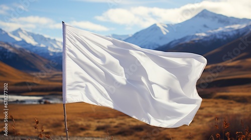 Blank white flag in the mountains. photo
