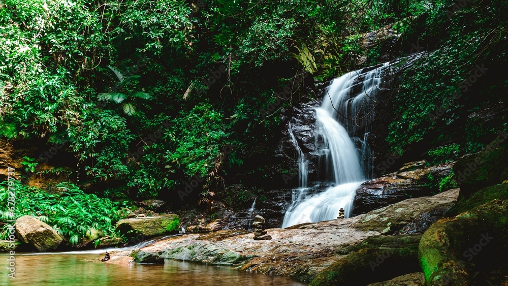 Beautiful shot of a waterfall in a forest during the day
