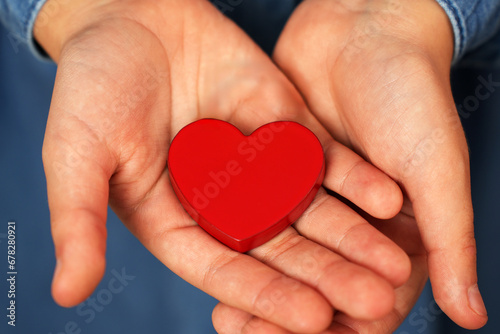 Valentine s day. Cute little child girl holding red heart