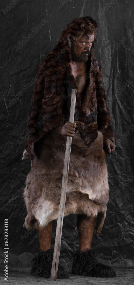 Obraz premium caveman with a club in a cave