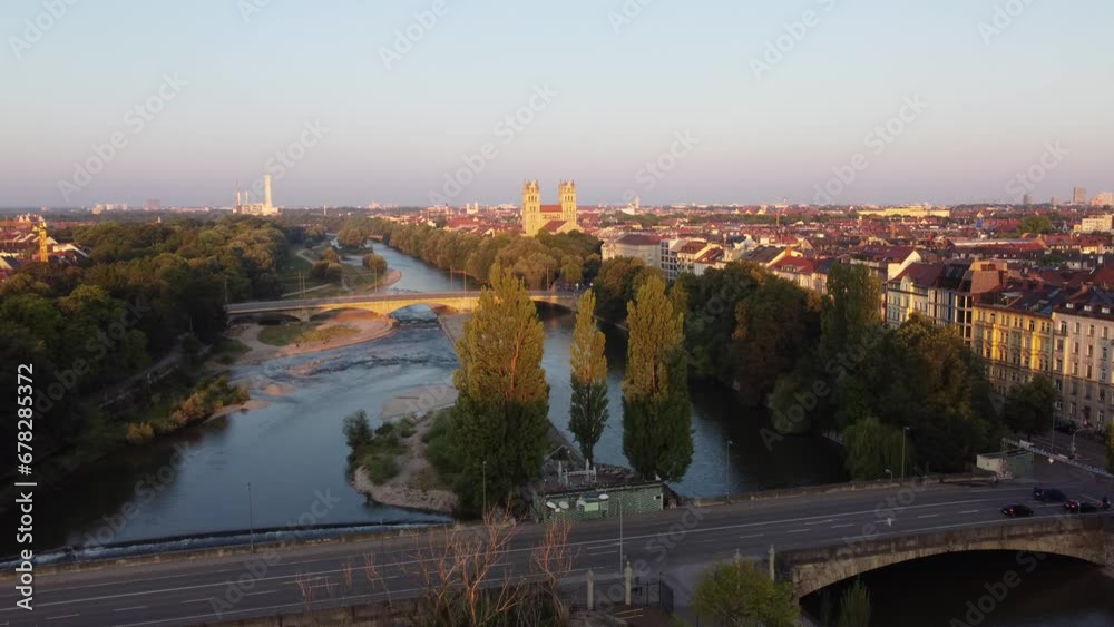 Isar river flowing through the city of Munich in a calm summer morning aerial image