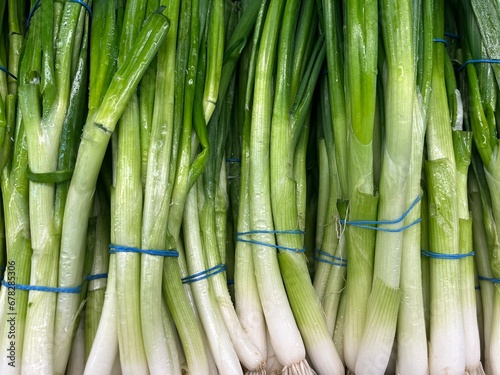 vegetables in the store, young onions on the counter