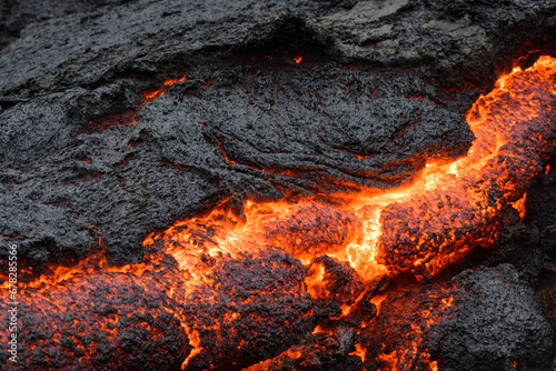 Glowing lava from a volcano in Iceland photo