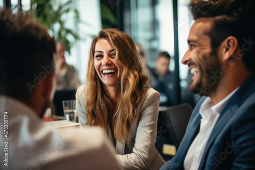 Picture of man and woman sitting at table, enjoying lighthearted moment together. Perfect for illustrating joy, friendship, or socializing