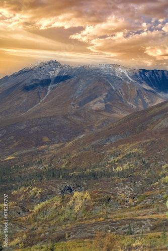 Canada, Yukon, view of the tundra in autumn, with mountains in background, beautiful landscape in a wild country 