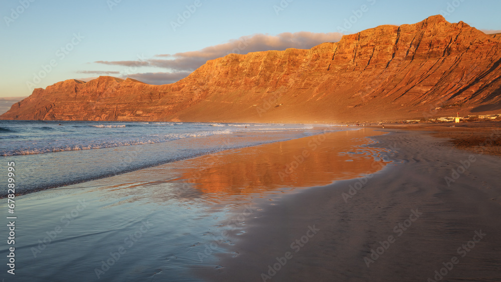 Sunset on Famara beach, popular surf beach Lanzarote. Canary Islands. Spain.