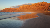 Sunset on Famara beach, popular surf beach Lanzarote. Canary Islands. Spain.