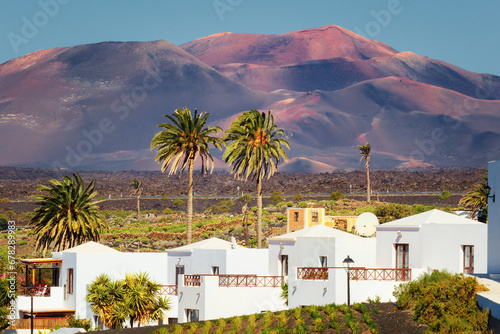 The volcanoes of the Timanfaya National Park seen from the town of Yaiza, Lanzarote, Canary Islands, Spain