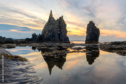 Rocks called Skjolfjorur reflect in the sea