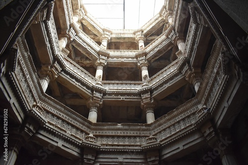 Low angle view of the interior of the famous Adalaj stepwell landmark in Gujarat, India photo