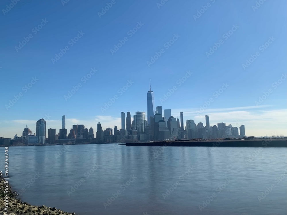 Cityscape of New Jersey from the shore with a blue sky in the background, the United States