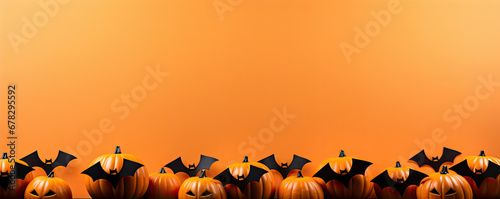 Black bats on orange background. hollween concept.