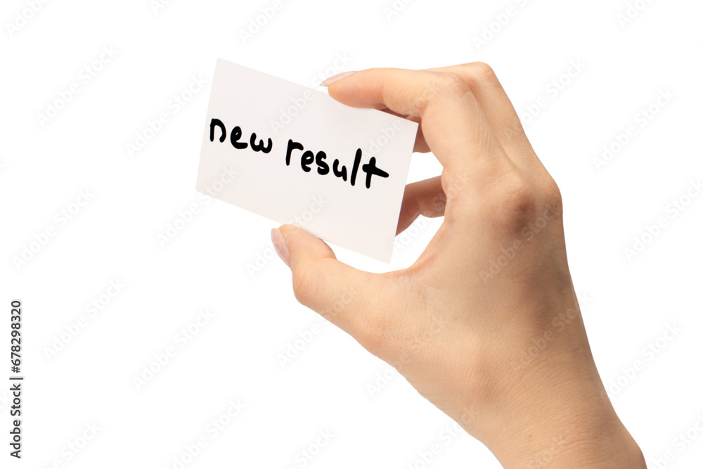 New mindset - new result text on a card in a woman hand. New mindset - new result text on a card in a woman hand.
