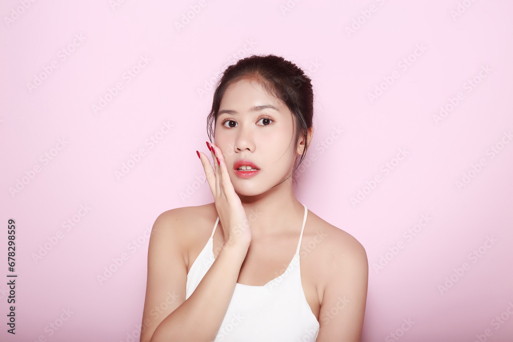 Portrait of beautiful young woman with clean fresh skin on pink background, Face care, Facial treatment. Cosmetology, beauty and spa. Asian women portrait Portrait of beautiful young woman with clean fresh skin on pink background, Face care, Facial treatment. Cosmetology, beauty and spa. Asian women portrait