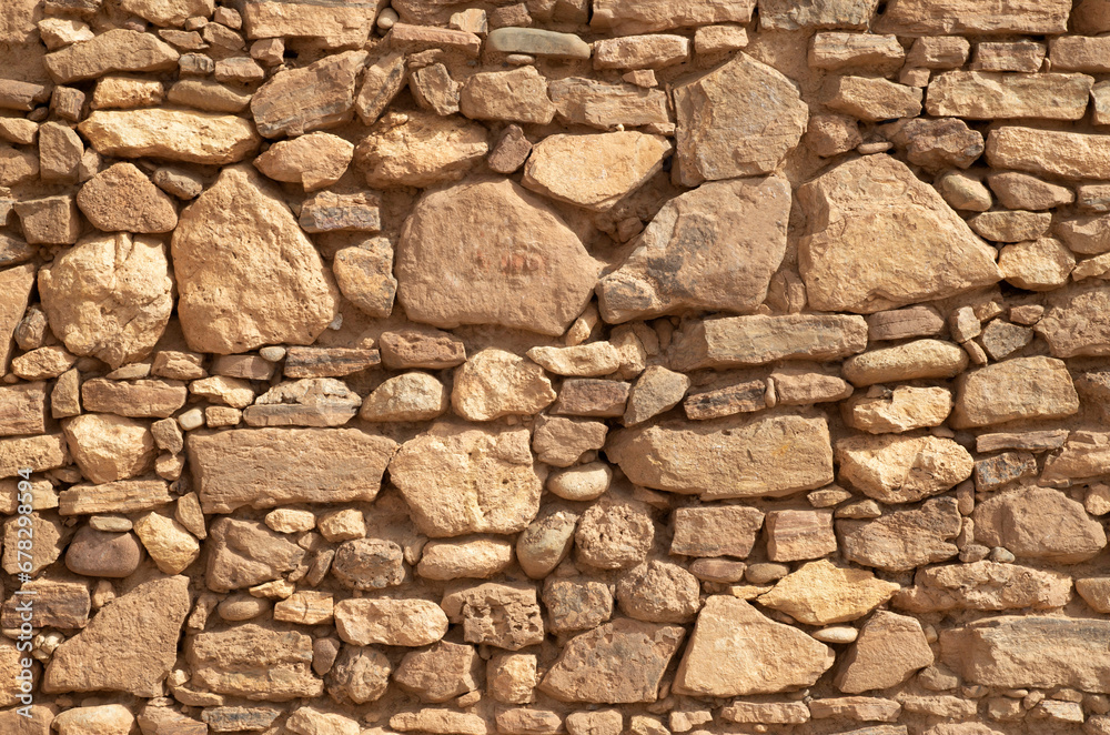 Fototapeta premium Colorful ancient stone wall closeup.