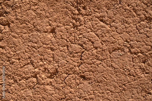 Old mud wall plaster with cracks closeup