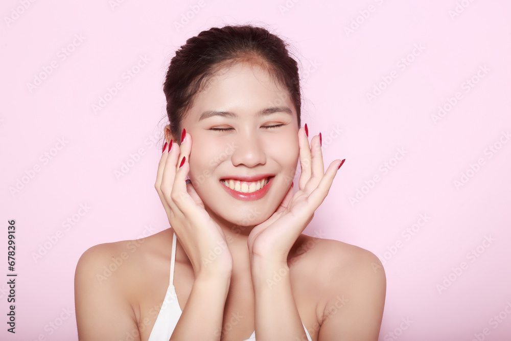 Portrait of beautiful young woman with clean fresh skin on pink background, Face care, Facial treatment. Cosmetology, beauty and spa. Asian women portrait Portrait of beautiful young woman with clean fresh skin on pink background, Face care, Facial treatment. Cosmetology, beauty and spa. Asian women portrait