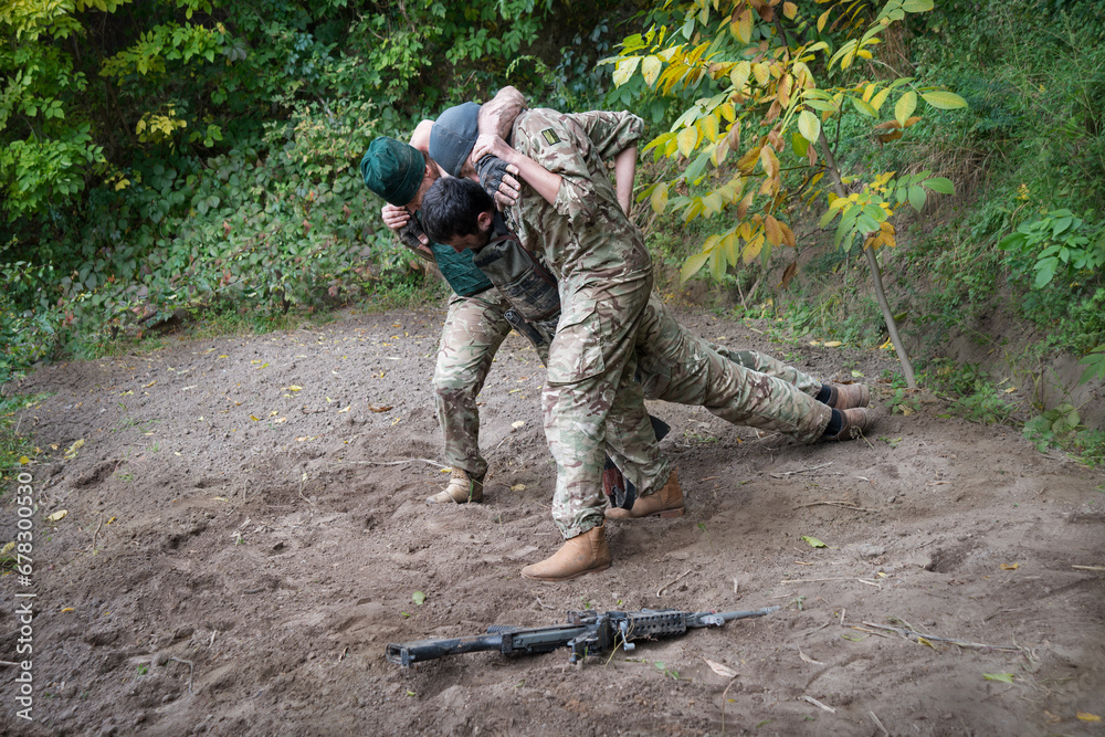 The medical workers carries a wounded soldier