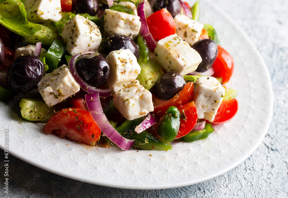 Greek salad with fresh vegetables, feta cheese and kalamata olives. Healthy food.