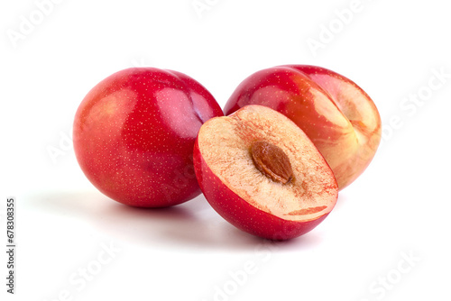 Red plum fruits, isolated on white background.